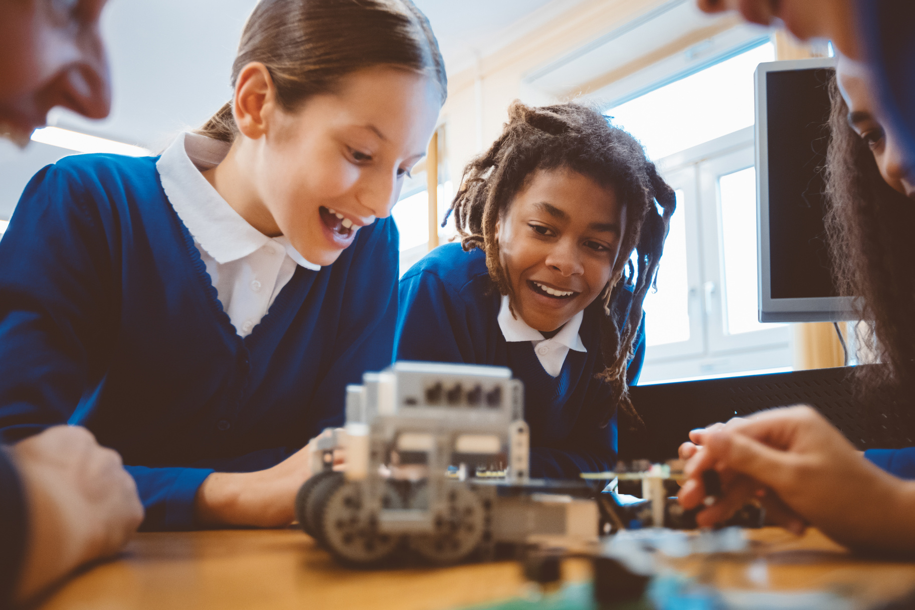 High school students learning robotics